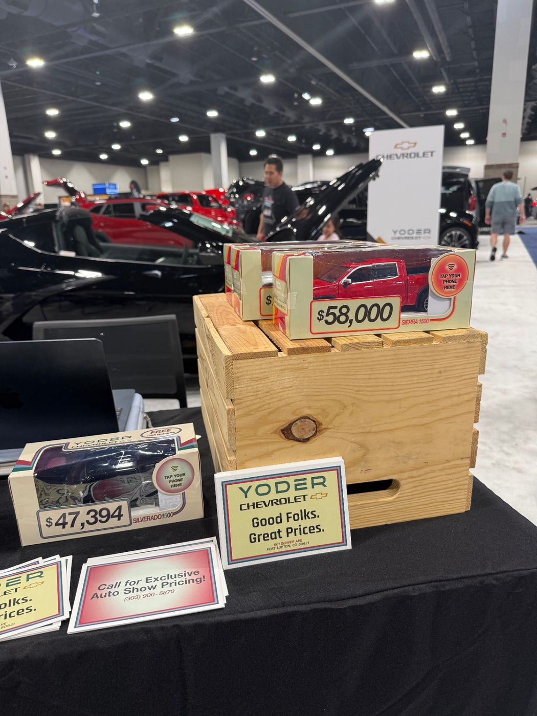 Colorado Auto Show display with Motibox boxes arranged on a branded table