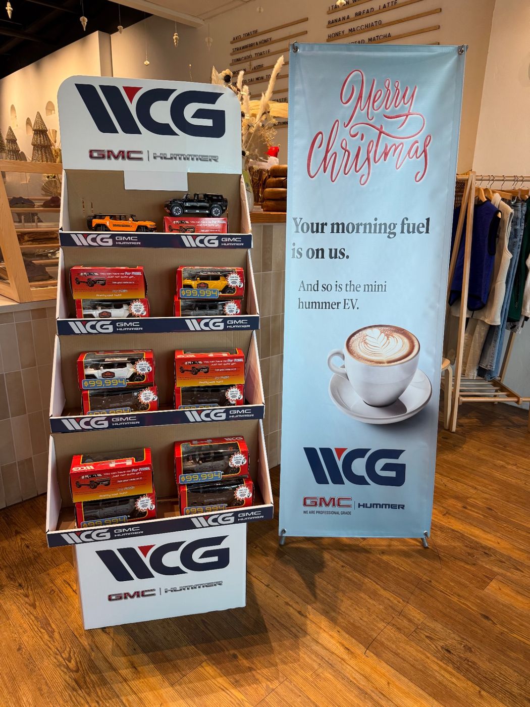 The Motibox retail display and Merry Christmas banner set up in the coffee shop